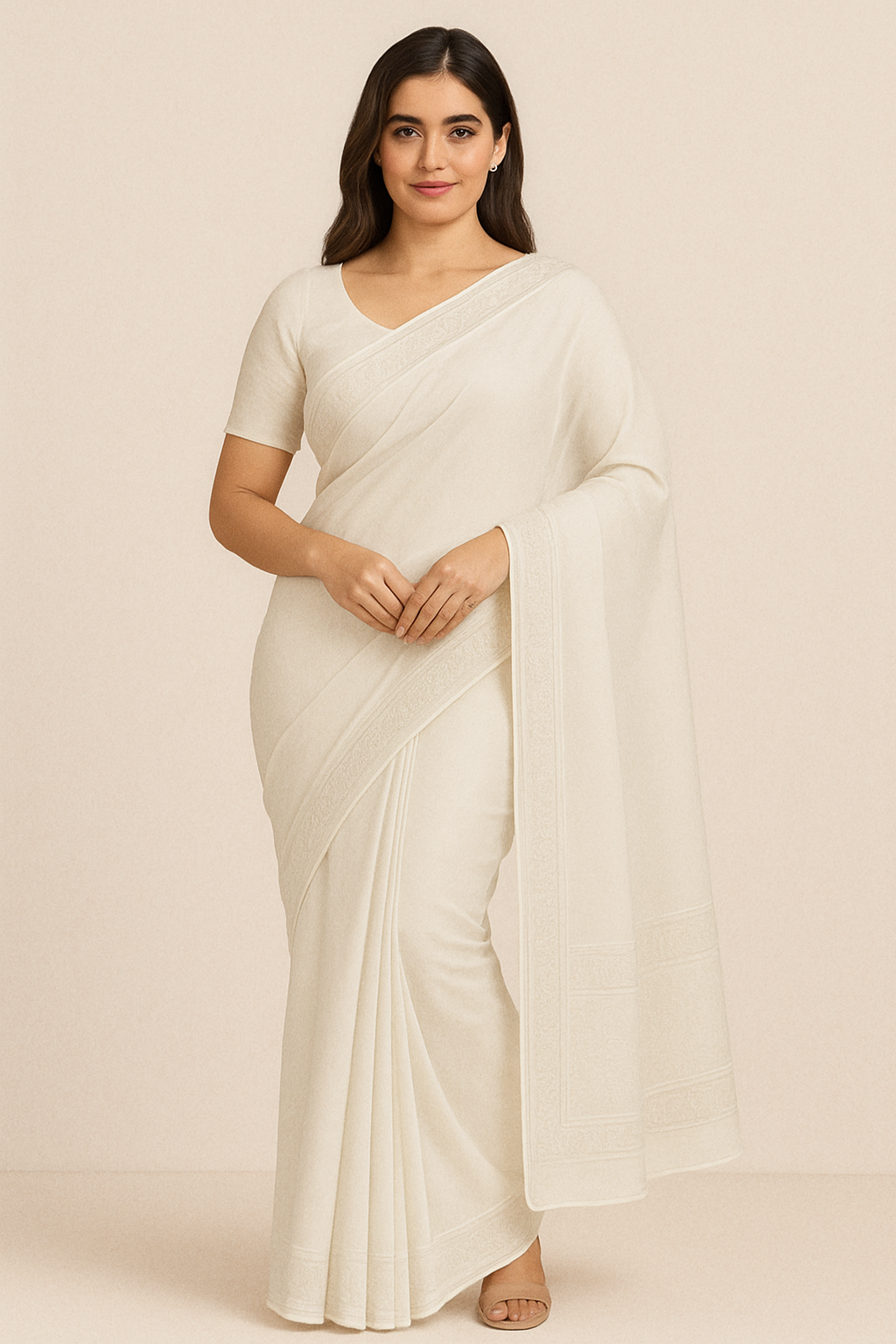 Woman wearing elegant cream white pure cotton saree with subtle woven border design