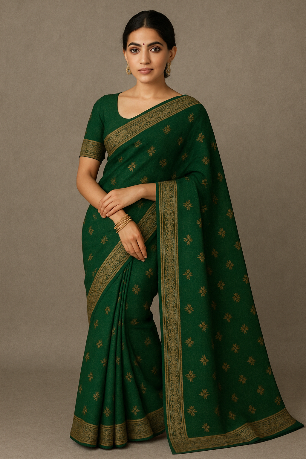 Woman wearing elegant green handloom saree with golden zari work, traditional festive Indian outfit