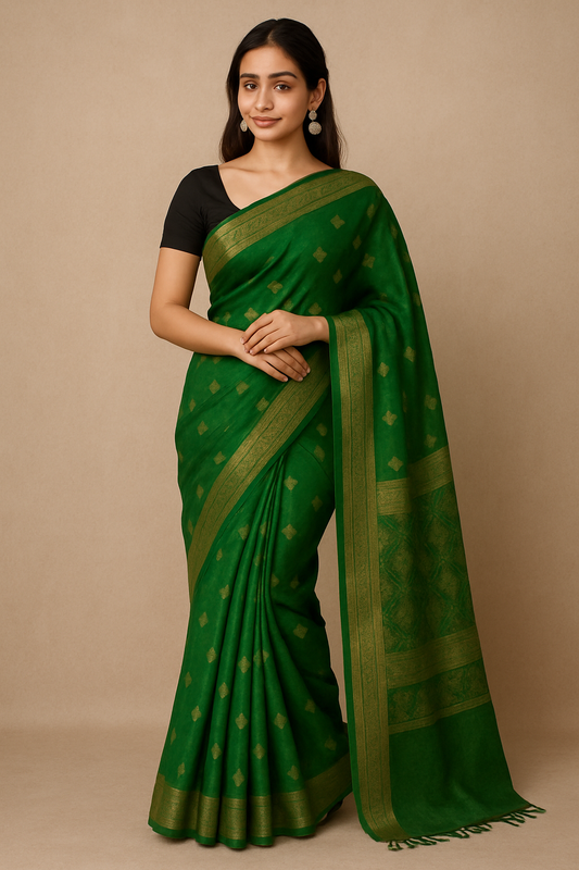 Elegant woman wearing a green silk saree with gold zari border and black blouse – traditional Indian ethnic wear