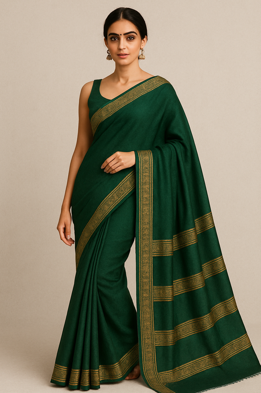 Model wearing bottle green woolen saree with golden zari border – traditional winter ethnic wear