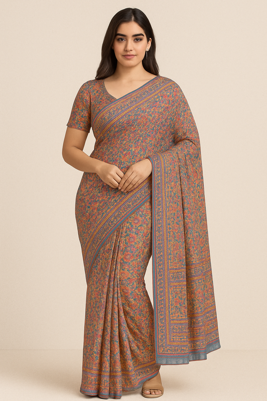 Woman wearing a rust blue floral print saree with intricate border design – lightweight and perfect for daily wear.